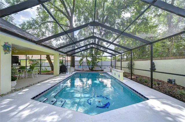 a view of a swimming pool with a patio