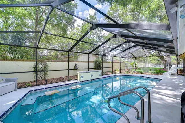a view of a swimming pool with a patio