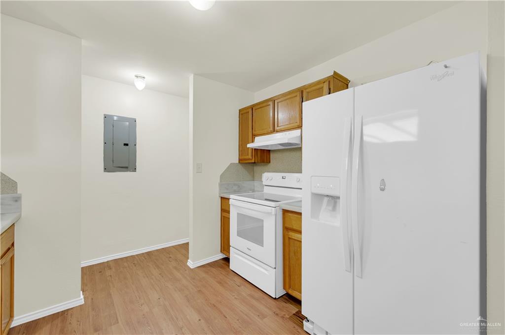 4200 Linda Vista Street Pharr, TX 78577 - Photo 6 of 17 a kitchen with a stove top oven