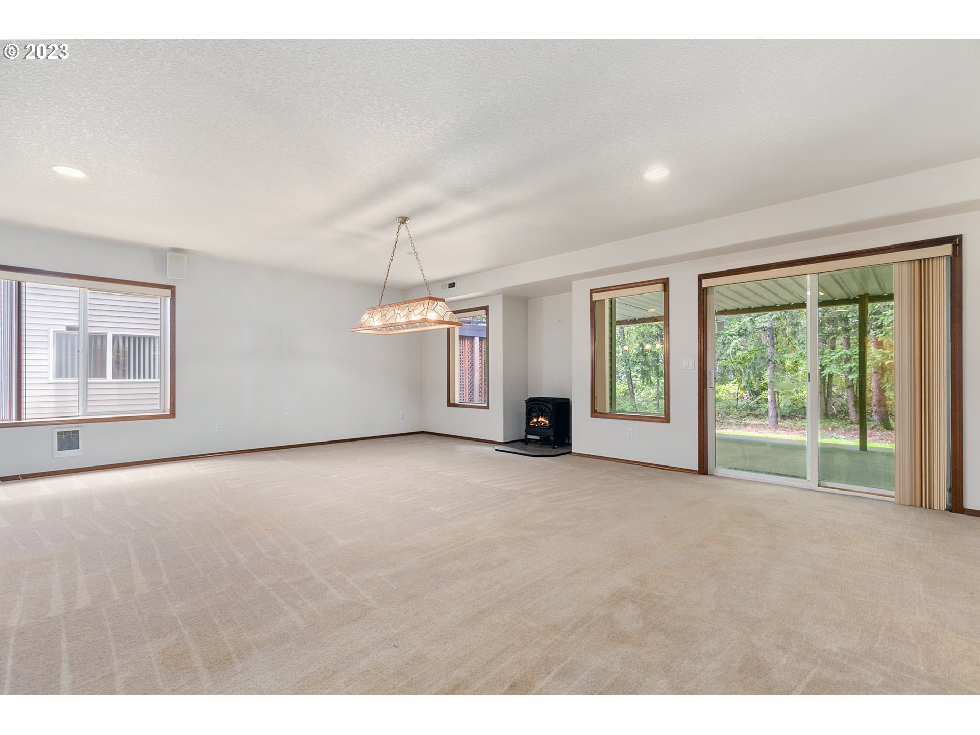 2217 Northeast 179th Street, Unit E10 Ridgefield, WA 98642 - Photo 15 of 23 a view of an empty room with a window