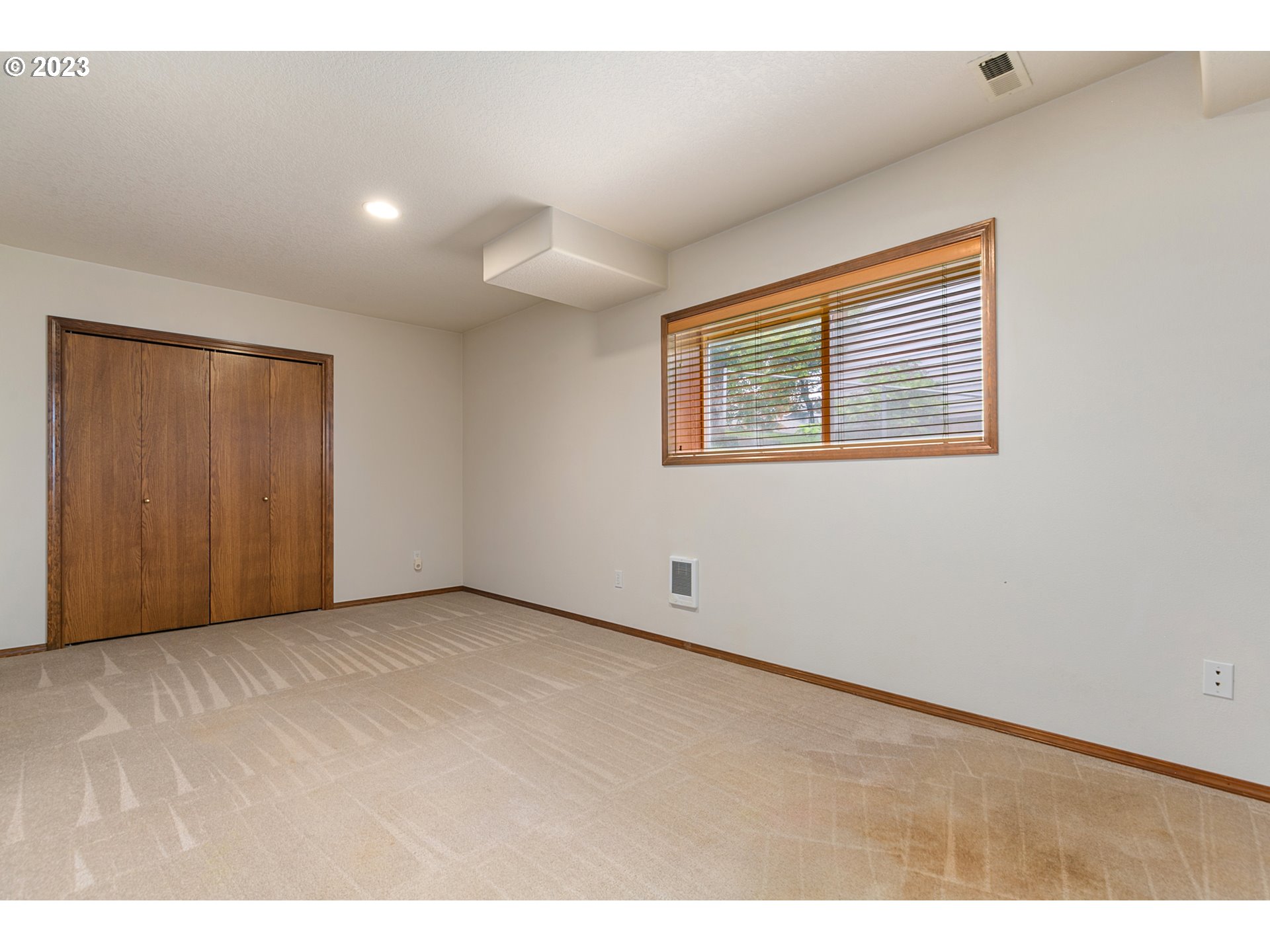 2217 Northeast 179th Street, Unit E10 Ridgefield, WA 98642 - Photo 20 of 23 a view of an empty room with a window