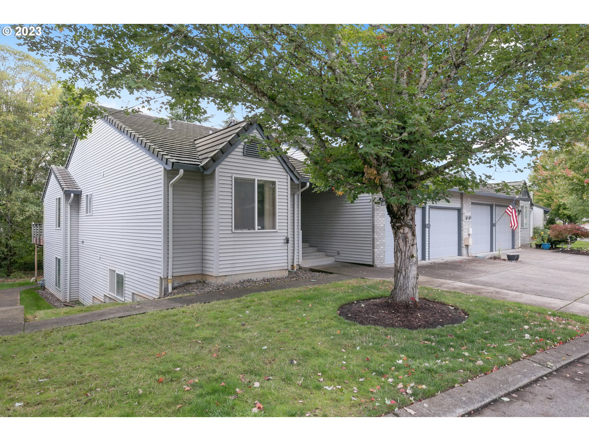 2217 Northeast 179th Street, Unit E10 Ridgefield, WA 98642 - Photo 2 of 23 a front view of house with a garden