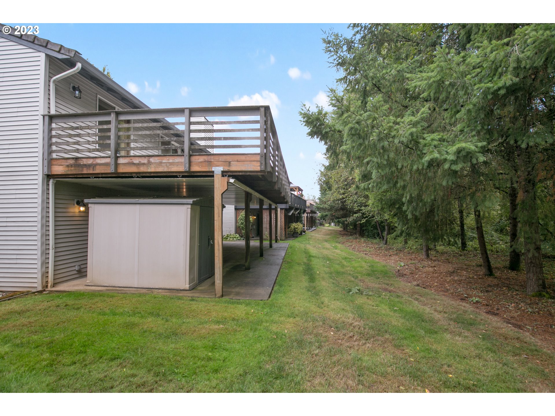 2217 Northeast 179th Street, Unit E10 Ridgefield, WA 98642 - Photo 22 of 23 a view of a house with a backyard