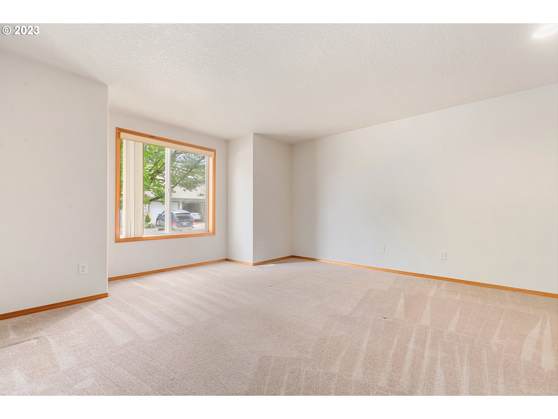 2217 Northeast 179th Street, Unit E10 Ridgefield, WA 98642 - Photo 3 of 23 a view of an empty room with a window
