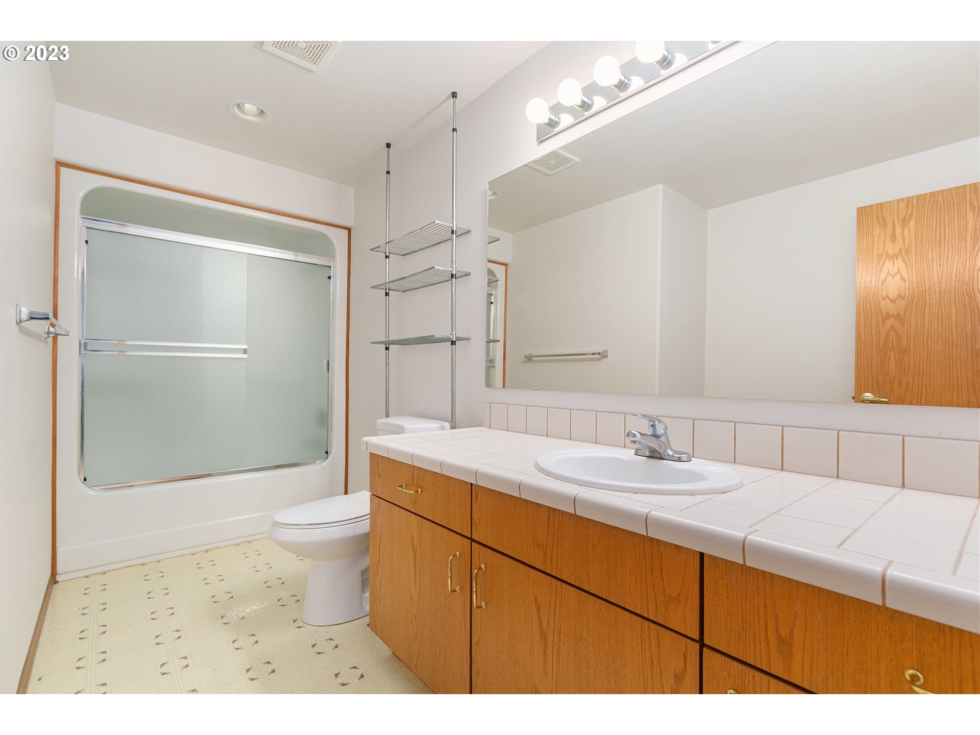 2217 Northeast 179th Street, Unit E10 Ridgefield, WA 98642 - Photo 5 of 23 a bathroom with a sink and a mirror