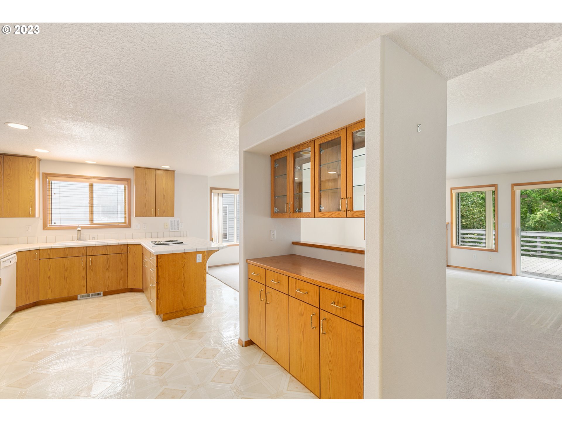 2217 Northeast 179th Street, Unit E10 Ridgefield, WA 98642 - Photo 7 of 23 a open kitchen with granite countertop a sink stove top oven and cabinets