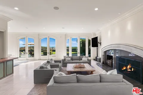 a view of a livingroom with furniture and window