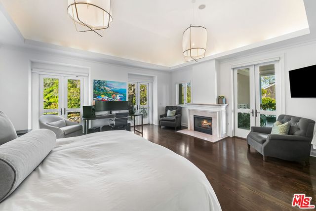 a view of roof deck with wooden floor and outdoor seating