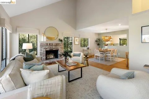 a living room with furniture couches and a fireplace