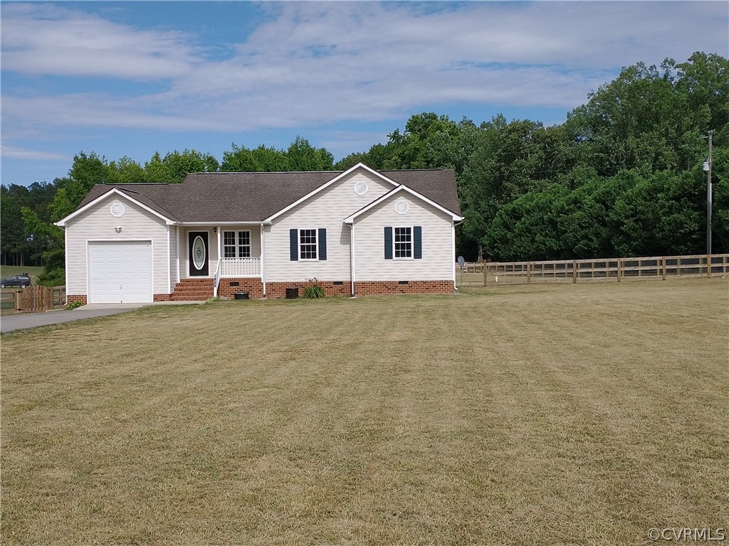 5929 Trinity Church Road Church Road, VA 23833 - Photo 1 of 26 a front view of a house with a yard and trees in the background