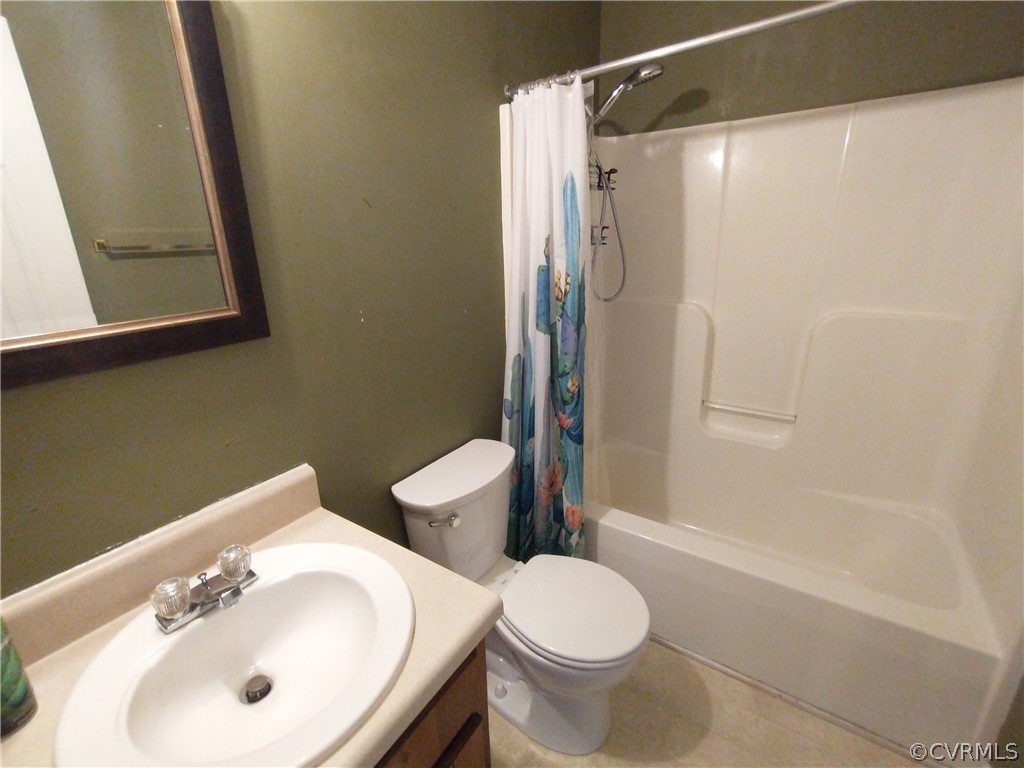 5929 Trinity Church Road Church Road, VA 23833 - Photo 15 of 26 a bathroom with a sink toilet and shower