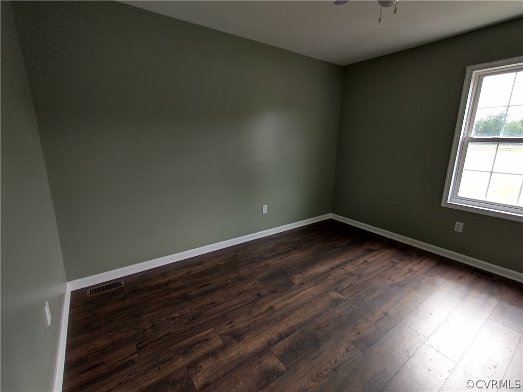 5929 Trinity Church Road Church Road, VA 23833 - Photo 19 of 26 an empty room with wooden floor and windows