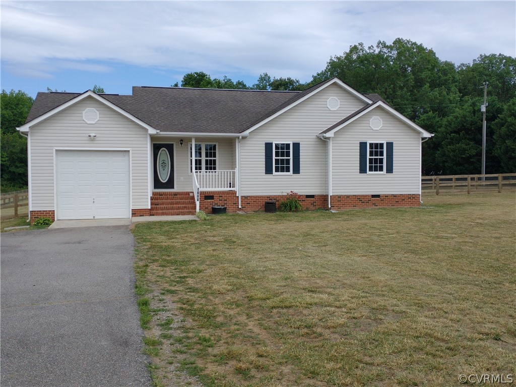 5929 Trinity Church Road Church Road, VA 23833 - Photo 22 of 26 a front view of house with yard and trees in the background