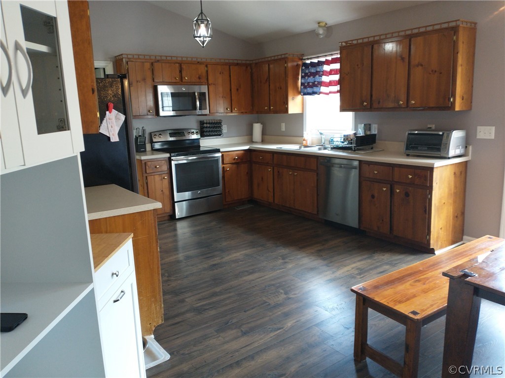 5929 Trinity Church Road Church Road, VA 23833 - Photo 6 of 26 a kitchen with stainless steel appliances a sink a stove a refrigerator cabinets and a counter top space