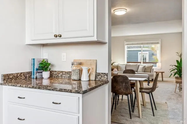 a kitchen with stainless steel appliances granite countertop a refrigerator a stove top oven a sink and dishwasher