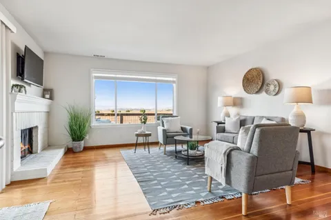 a living room with lots of furniture and a table