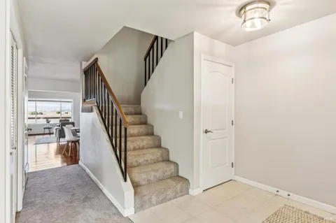 a bedroom with furniture and a large window
