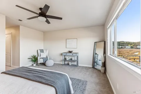 an empty room with windows and closet