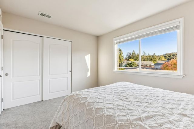 a view of a balcony with wooden chairs with wooden floor