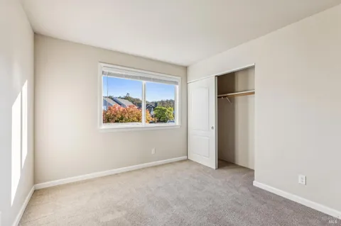 a view of an empty room with a fireplace