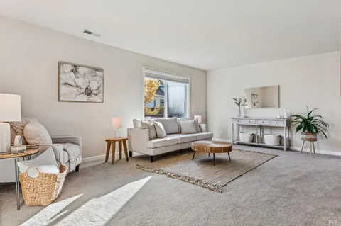 a dining room with a table and chairs