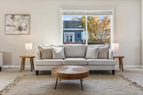 a kitchen with granite countertop a stove sink and cabinets
