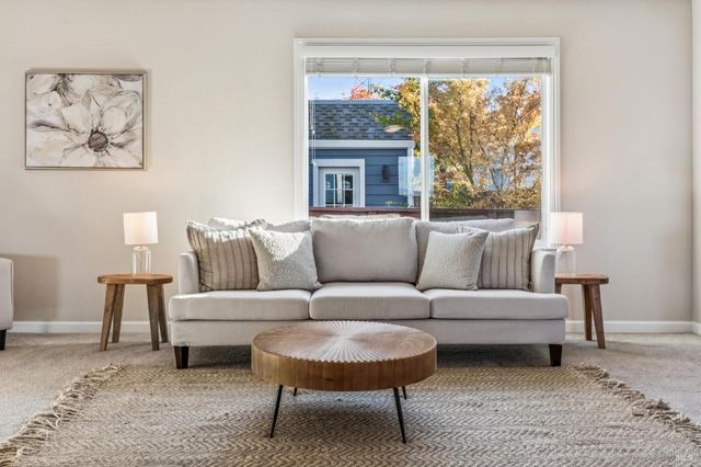 a kitchen with granite countertop a stove sink and cabinets