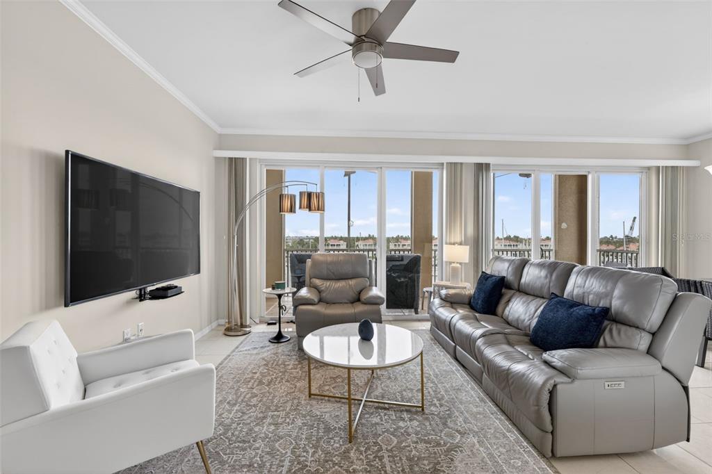 2060 Matecumbe Key Road, Unit 2506 Punta Gorda, FL 33955 - Photo 4 of 38 a living room with furniture and a flat screen tv