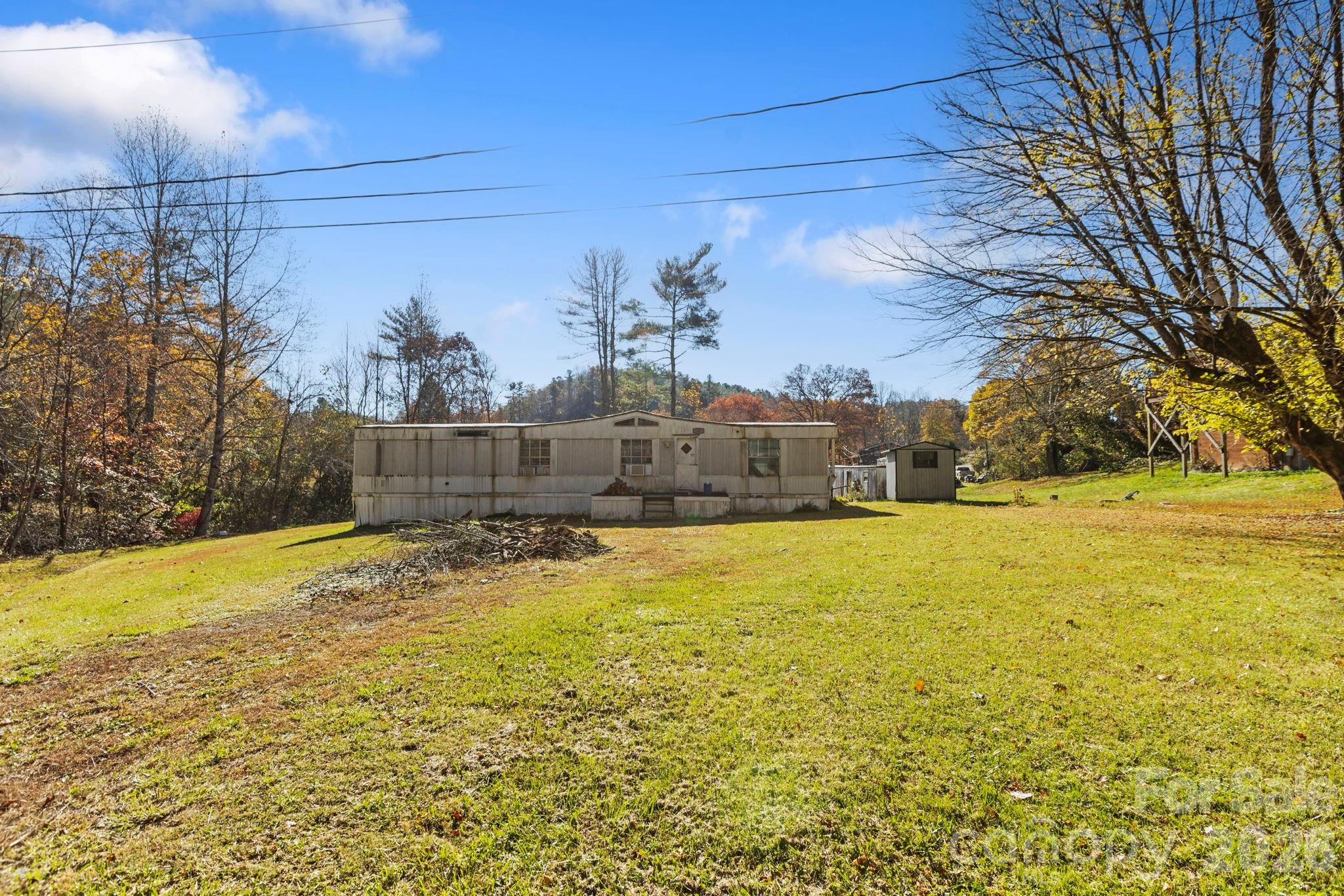 28 Trent Road Brevard, NC 28712 - Photo 3 of 3 a view of swimming pool with an outdoor space and seating area