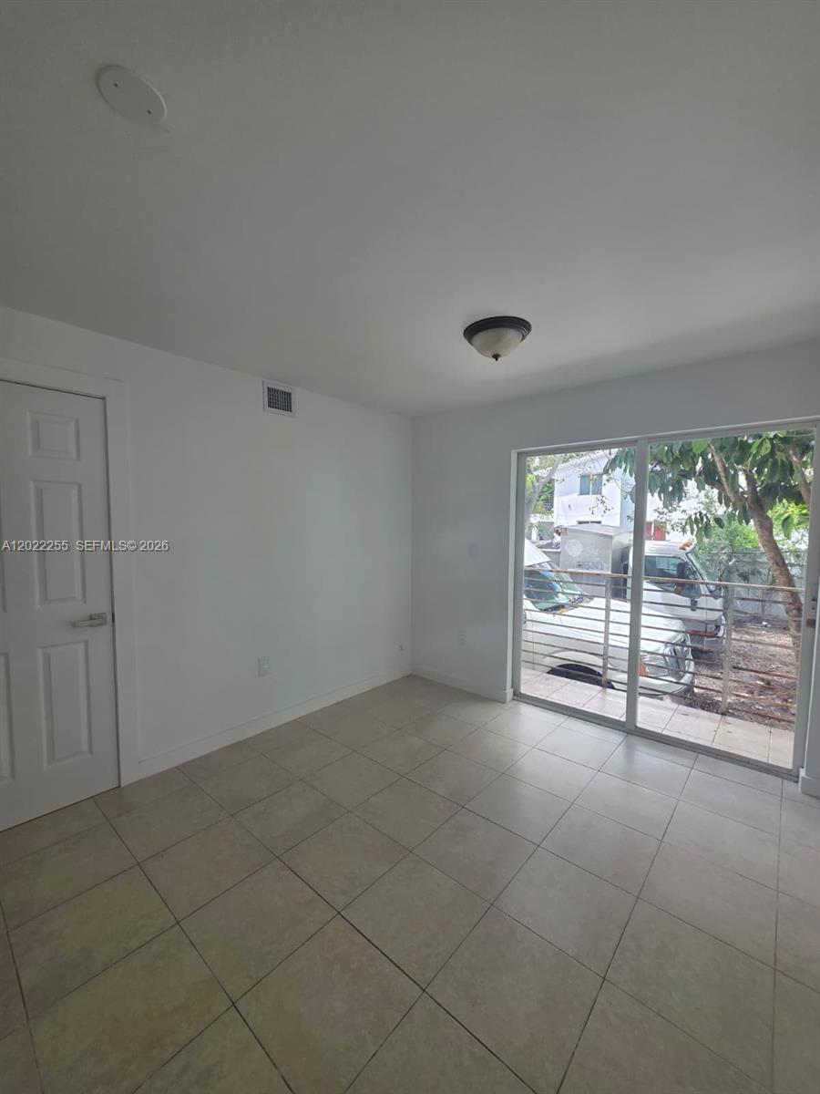 829 Southwest 3rd Street, Unit 831 Miami, FL 33130 - Photo 15 of 21 a view of an empty room with a window