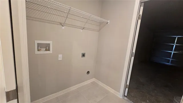 a bathroom with a granite countertop sink and a toilet