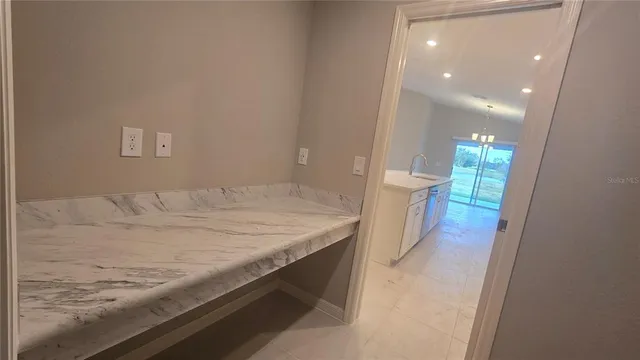 a kitchen with stainless steel appliances a refrigerator and a stove