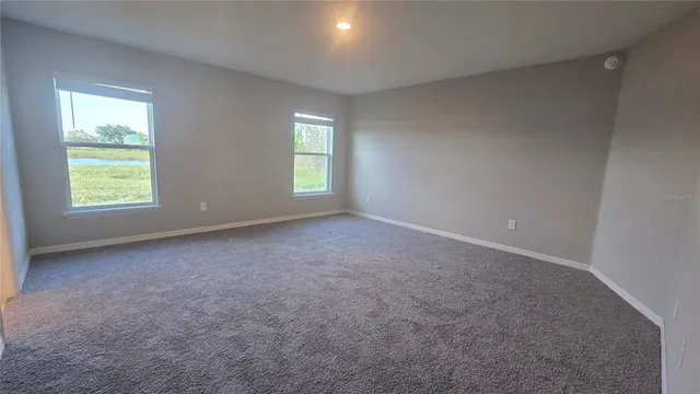 a bathroom with a double vanity sink and mirror