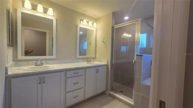 a white toilet sitting next to a shower