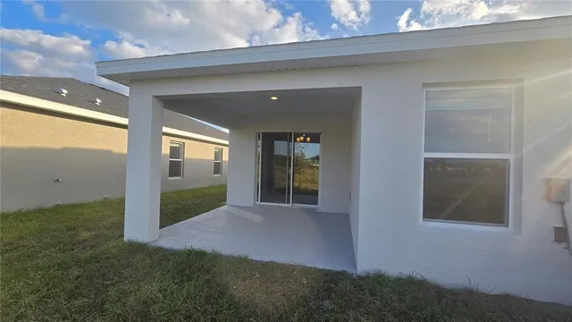 a view of a balcony with yard