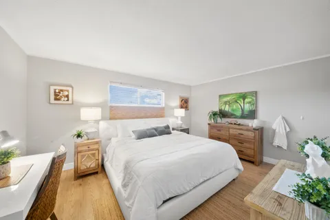 a bedroom with a bed and a couch