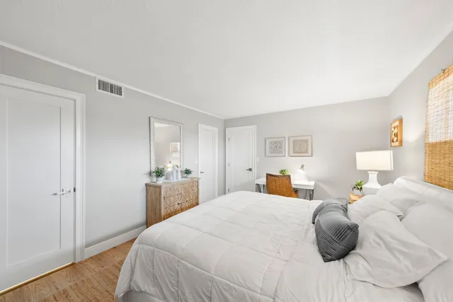 a bedroom with a bed and window