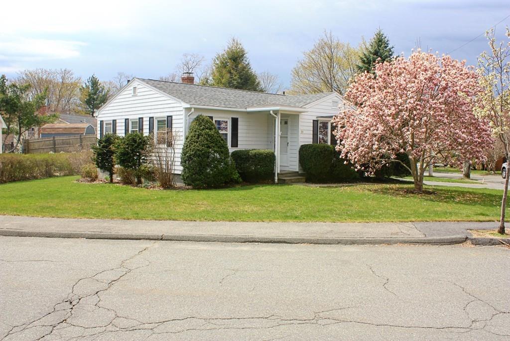 39 Kenneth Road Marblehead, MA 01945 - Photo 2 of 27 a front view of a house with a yard and potted plants