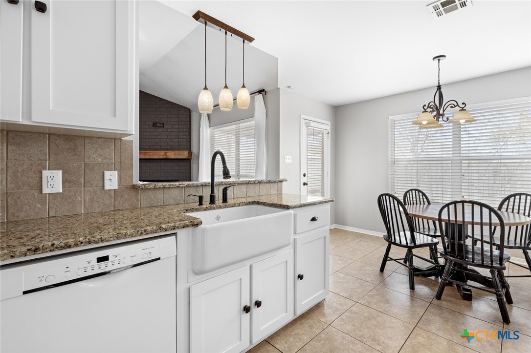 808 Silver Stone Drive Temple, TX 76502 - Photo 13 of 31 a kitchen with stainless steel appliances kitchen island granite countertop a sink and cabinets