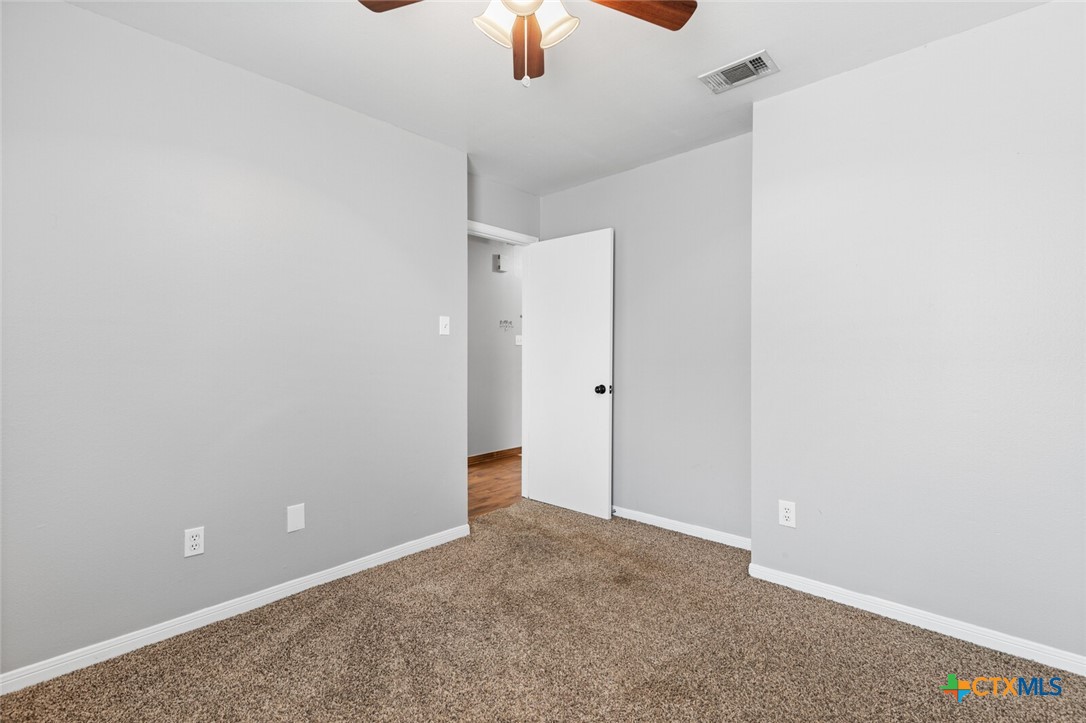 808 Silver Stone Drive Temple, TX 76502 - Photo 21 of 31 an empty room with a ceiling fan and a window