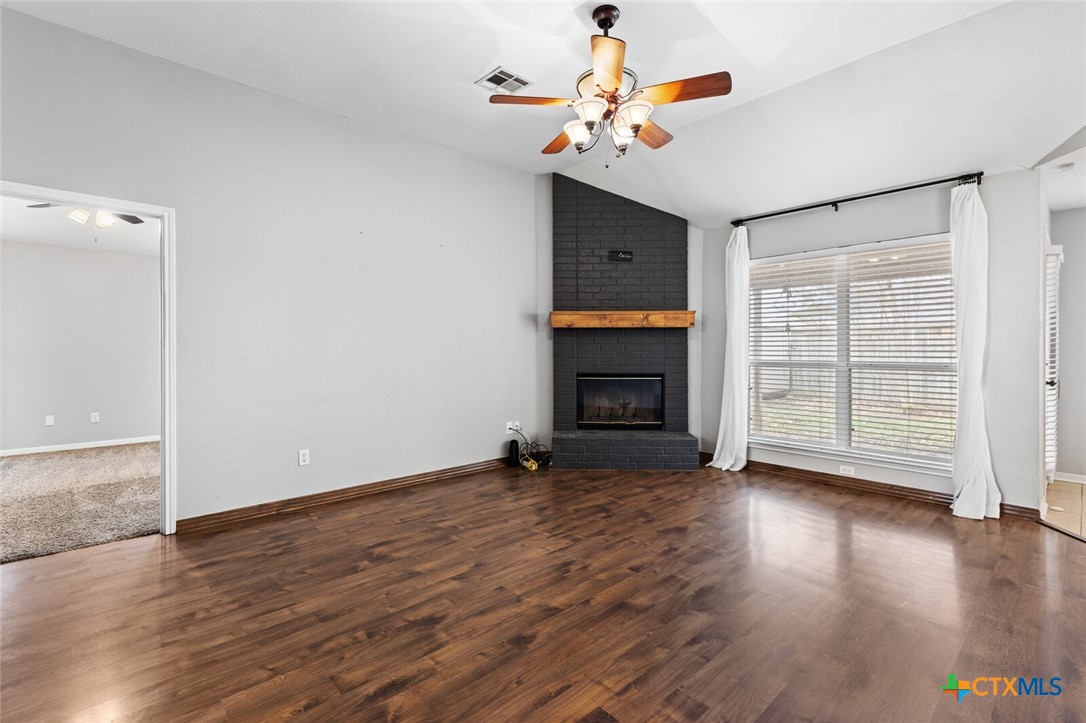 808 Silver Stone Drive Temple, TX 76502 - Photo 5 of 31 wooden floor in an empty room with a window