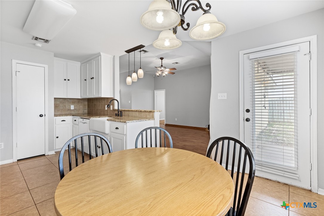 808 Silver Stone Drive Temple, TX 76502 - Photo 9 of 31 a view of a dining room with furniture and chandelier