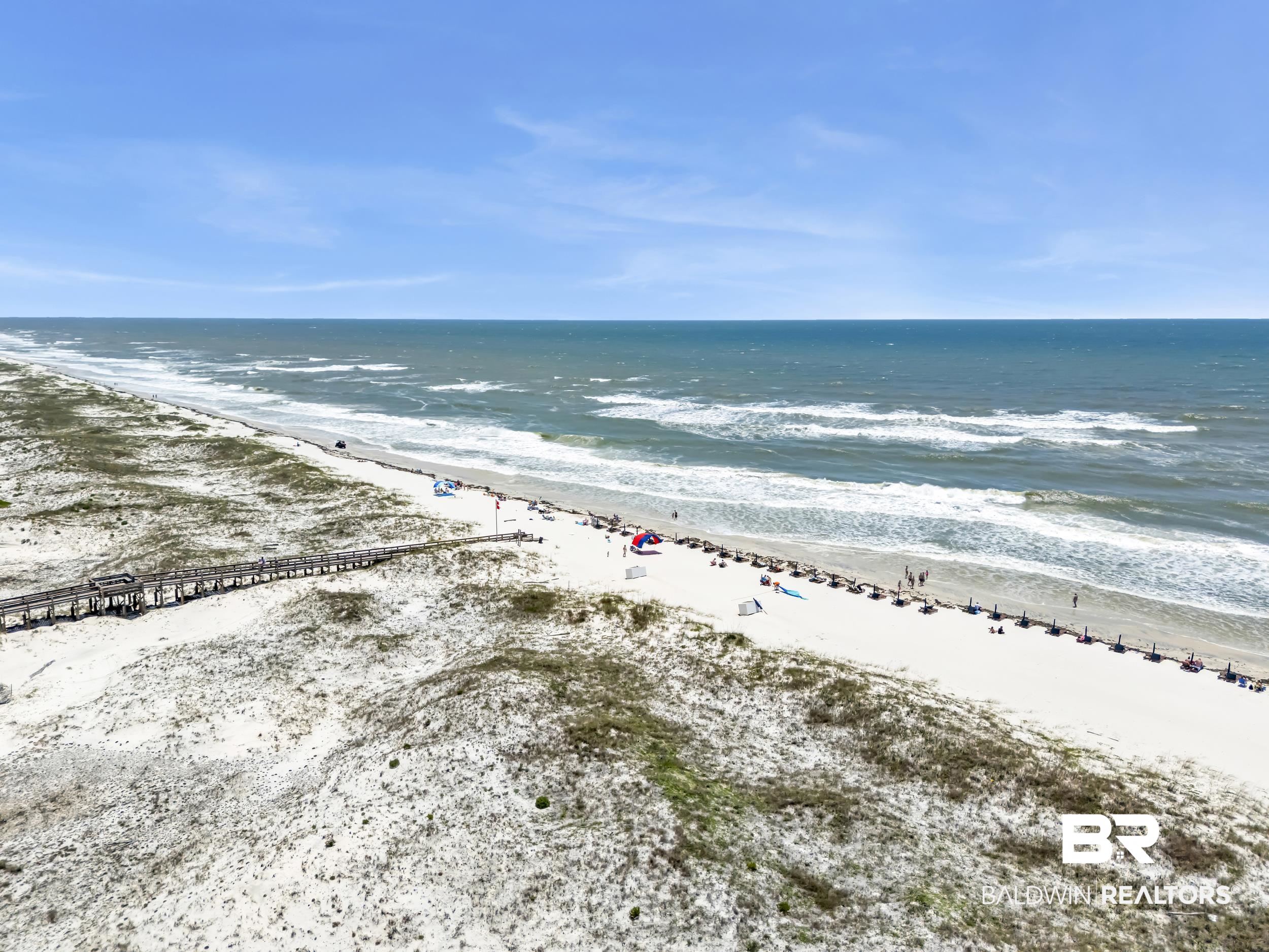 400 Plantation Road, Unit 2118 Gulf Shores, AL 36542 - Photo 39 of 59 Expansive sandy beach with ocean frontage and a long wooden boardwalk