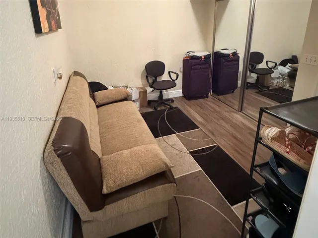 a living room with furniture and a rug