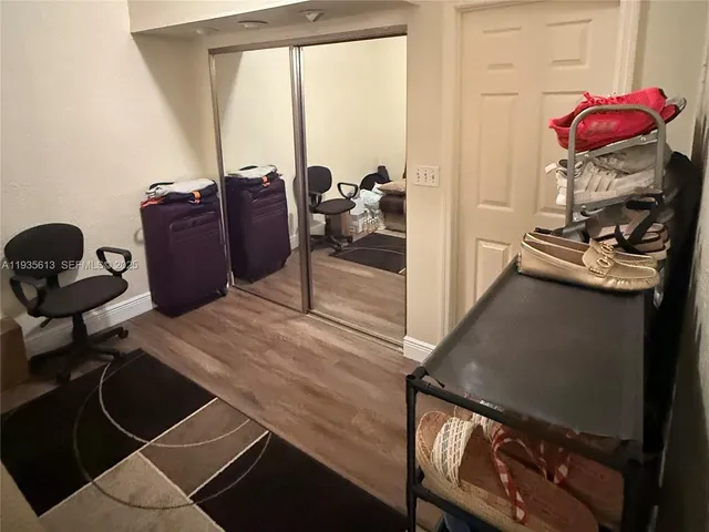 a view of a workspace with furniture