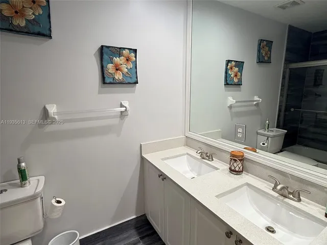 a bathroom with a sink and a toilet