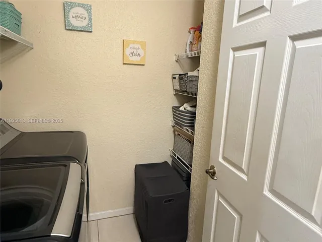 a view of bathroom with a toilet and a wooden floor