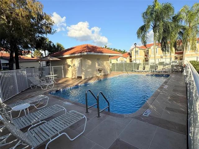 a view of a swimming pool with a patio