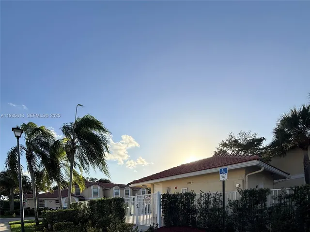 a view of a street with houses on both side
