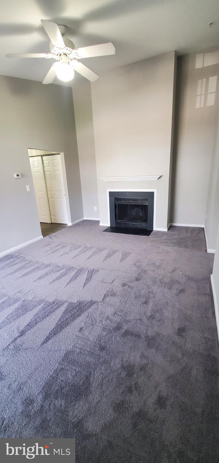 8343 Montgomery Run Road Ellicott City, MD 21043 - Photo 16 of 27 Spacious living area with cozy fireplace.